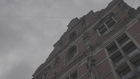 random shot of the borson building in copenhagen filmed from below on a cloudy day log