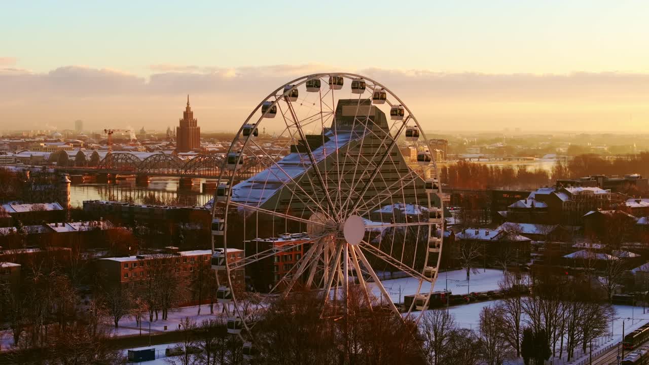 Drone captures snowy Latvian capital glowing in winter morning sunlight
