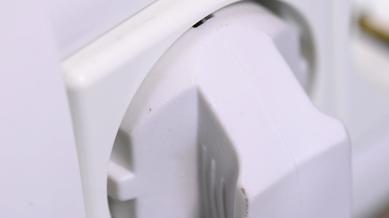 Extreme close-up of plugging and unplugging from the European power socket