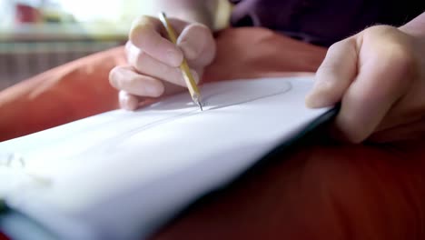 person drawing a spoon