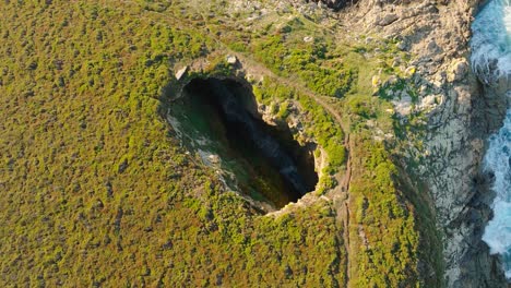 Crashing-Waves-Inside-The-Hole-Of-Monte-Furado-In-A-Coruña,-Spain