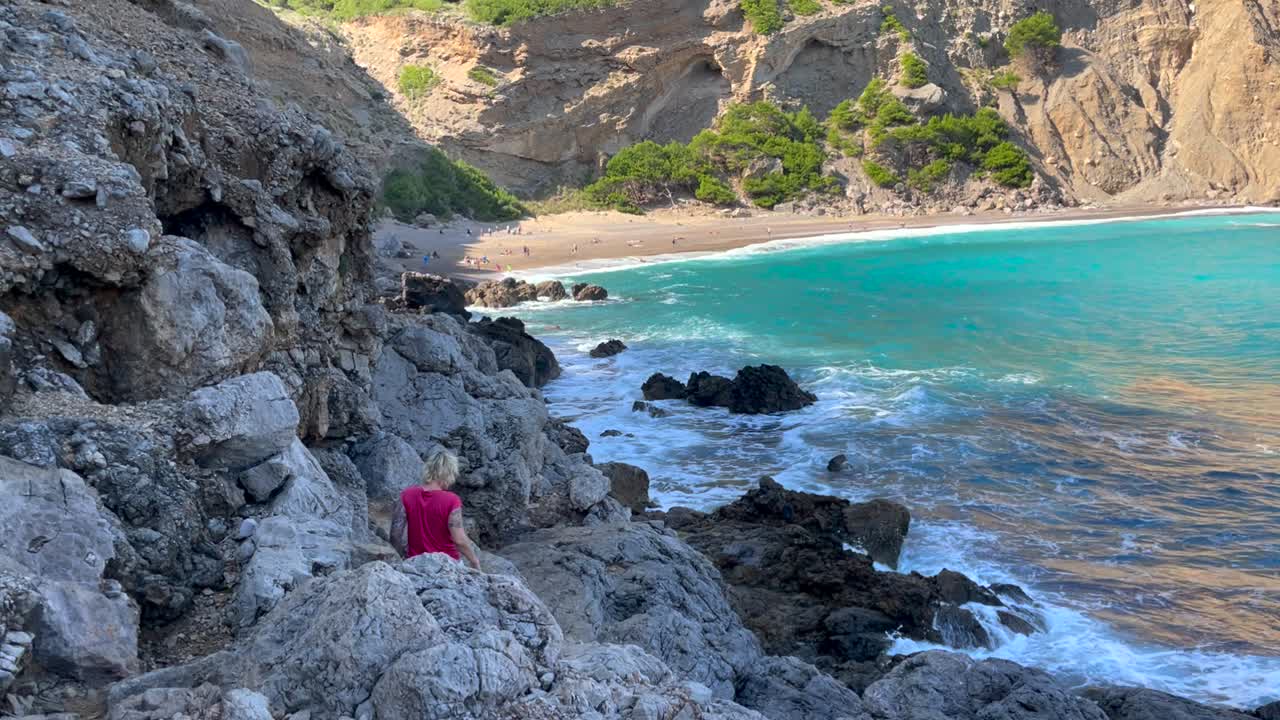 Women Hiking On Cliffs Along Sea, Coll Baix Mallorca, Spain