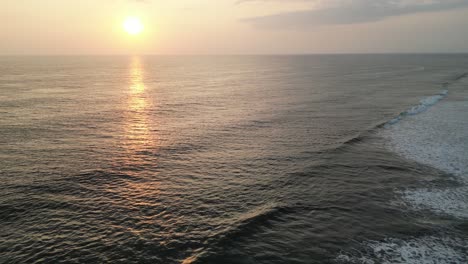 Flying-over-the-Pacific-Ocean-towards-sunset-at-Playa-Cuevita-in-the-remote-Chocó-department-on-the-Pacific-Coast-of-Colombia