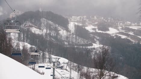 snowy ski resort landscape with ski lifts