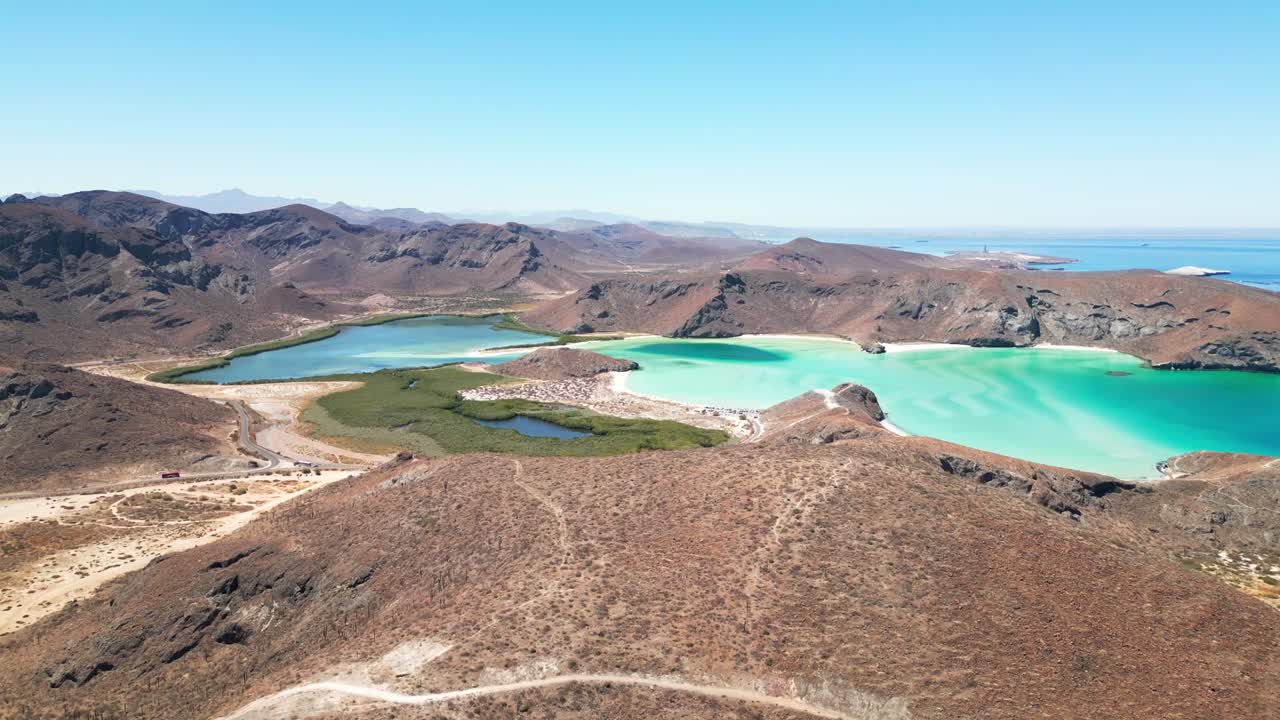 Turquoise lagoon, desert mountains, and coastline near tecolotito, la paz, mexico, aerial view