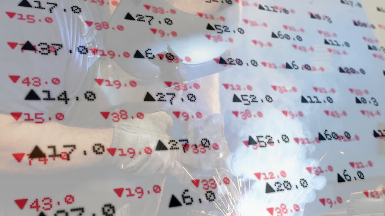 Welder welding metal piece inside industrial workshop, showing animated red and black data overlays