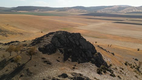 elevated rocky terrain over plains on remote nature landscape