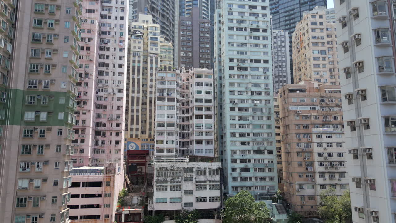 Thousands Of Apartment Block Windows In Central Hong Kong Island Drone Rise 4K 60FPS