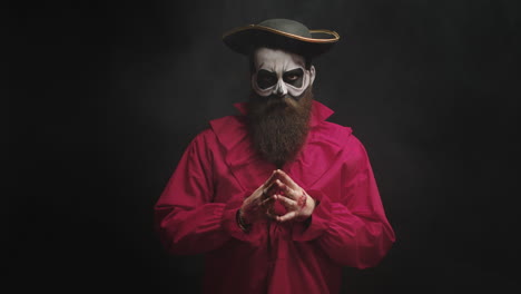 adult man with long beard dressed up like a spooky captain