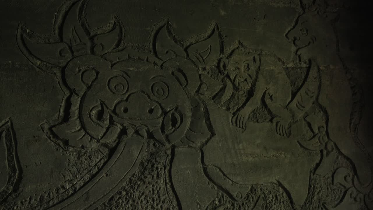 Balinese culture heritage wall stone. carving drawing Bali Monkey forest Ubud cave