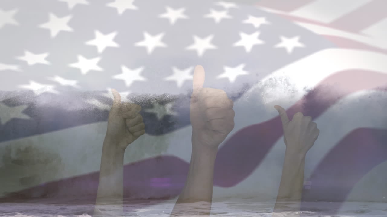 Animation of flag of usa blowing over hands in okay gesture over beach landscape