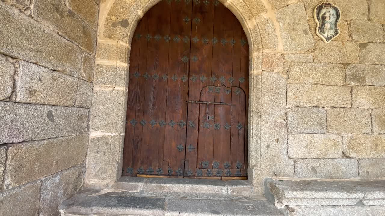 Ancient Wooden Church Door in Stone Wall