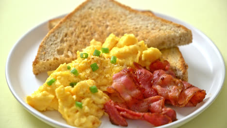 scramble egg with bread toasted and bacon for breakfast