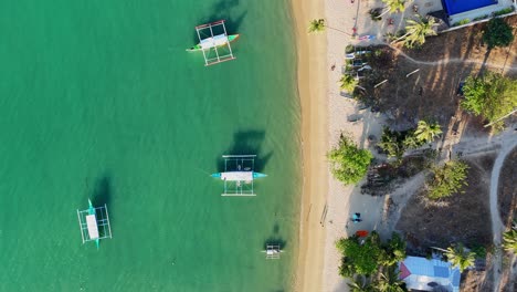 Top-down-drone-footage-of-Port-Barton's-beach-on-Palwan-island-in-the-Philippines