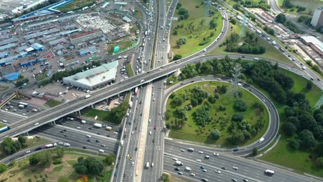 aerial view around highway interchange during rush hour, urban conceptual