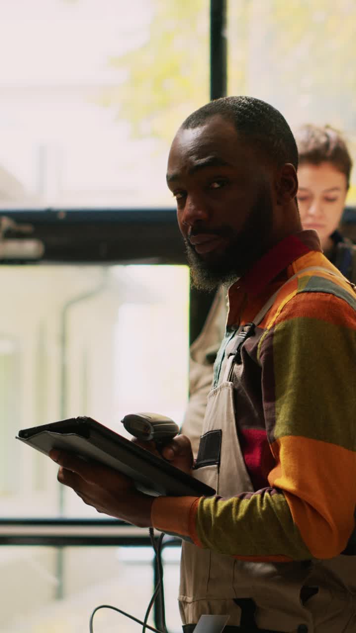 Vertical video: Employees team using scanner and tablet