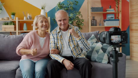 senior couple vlogging from home