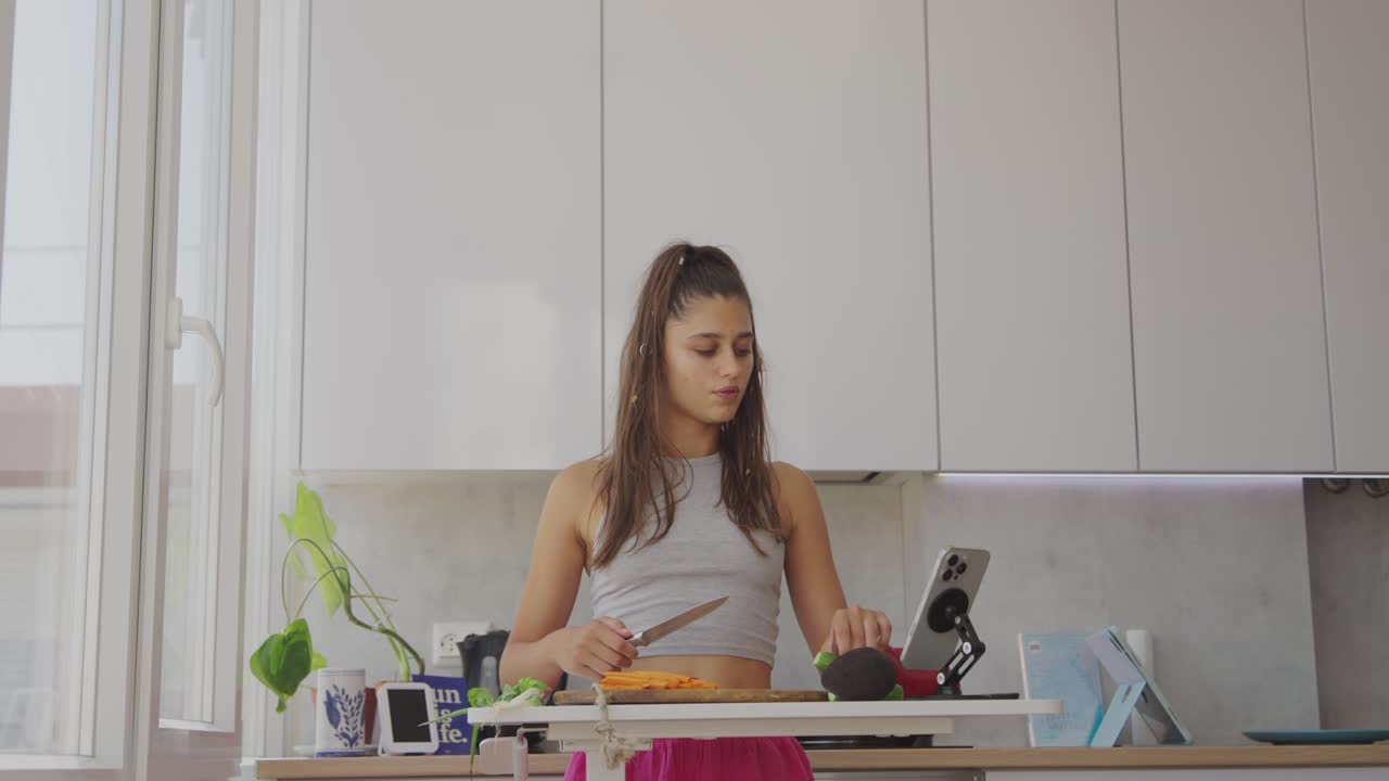 A young woman preparing healthy food in a modern kitchen