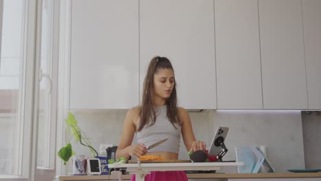 a young woman preparing healthy food in a modern kitchen