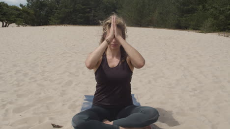 Beautiful-woman-bringing-folded-hands-to-third-eye-chakra---wide