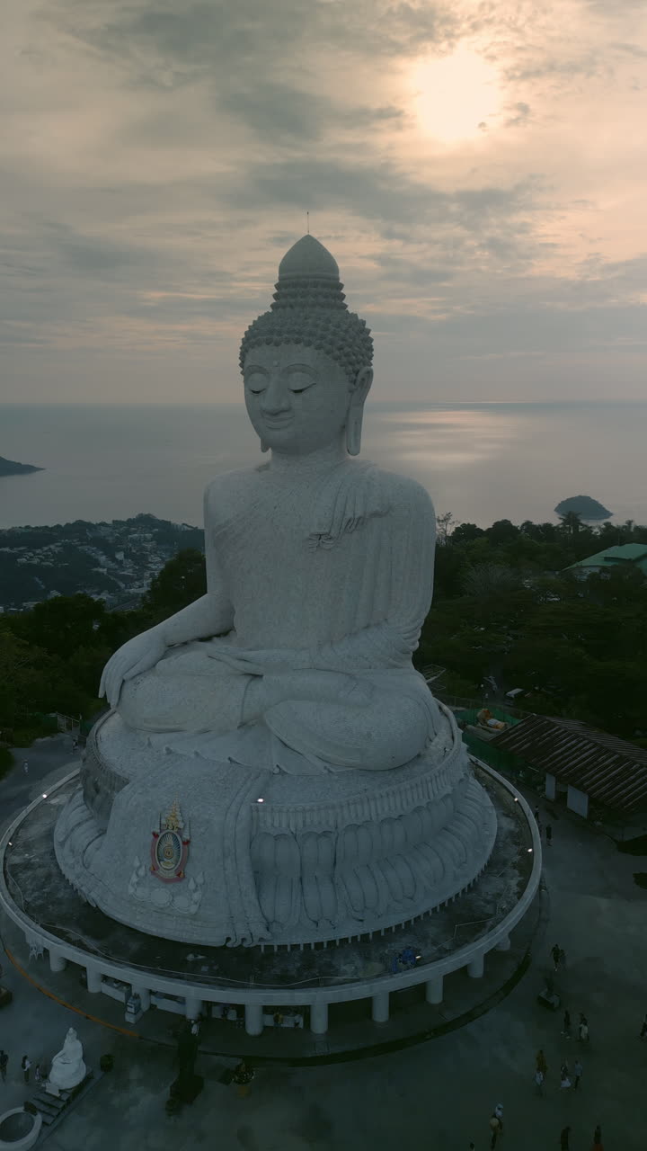 Giant Buddha Statue at Sunset with Ocean View