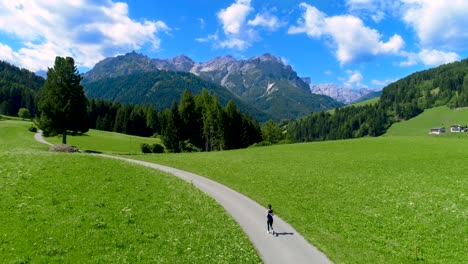 Woman-jogging-outdoors.-Italy-Dolomites-Alps