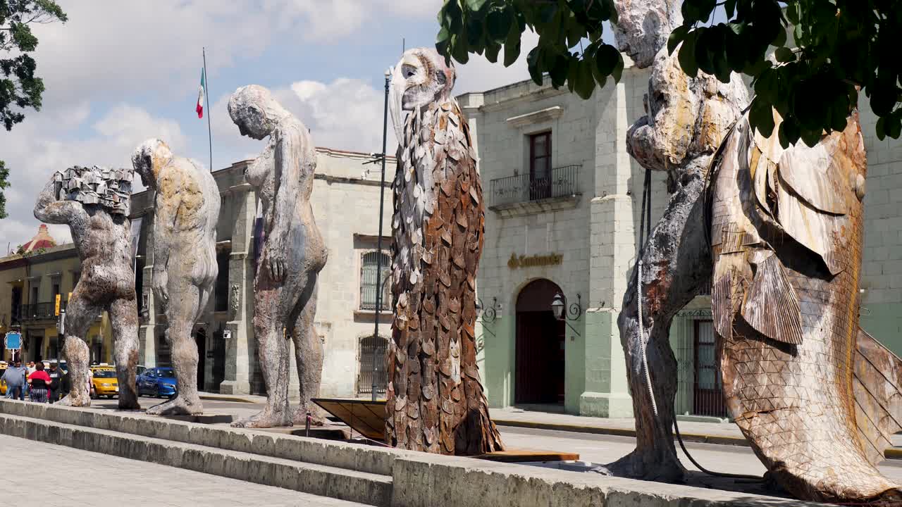 Slow motion landscape of giant metal sculptures art statue design installations Zócalo museum park in Oaxaca city downtown Mexico travel tourism culture