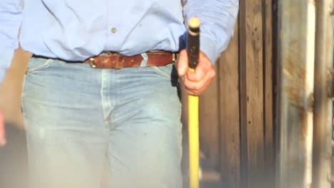 slow motion shot of a man walking towards the camera in a rural setting