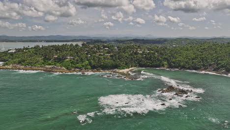 mirissa sri lanka aerial v19 flyover palapana gala reef capturing rugged coastline, secret beach with pristine sand and clear water and hillside resort hotels - shot with mavic 3 cine - april 2023