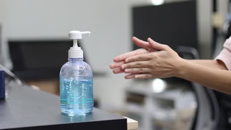 person demonstrating proper hand sanitizing technique