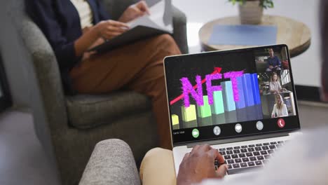 African-american-businessman-using-laptop-for-video-call-with-diverse-business-colleagues