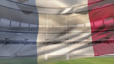 Bandera-Ondeando-Frente-A-Un-Estadio
