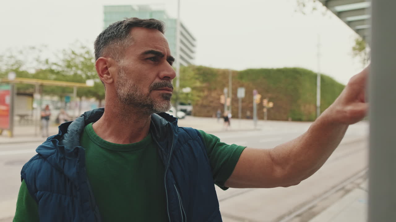 Man Waiting at Bus Stop