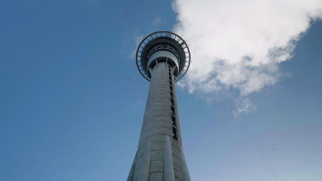 a wide shot time-lapse looking up at the sky tower in auckland, new zealand