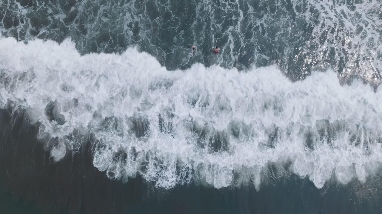 Aerial Top Down Drone view of People in Shorebreak at El Tunco El Salvador