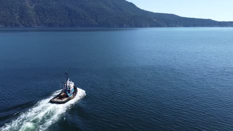 tugboat cruising through howe sound