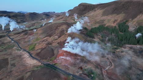 steams arising in geothermal area in hveragerdi, south iceland