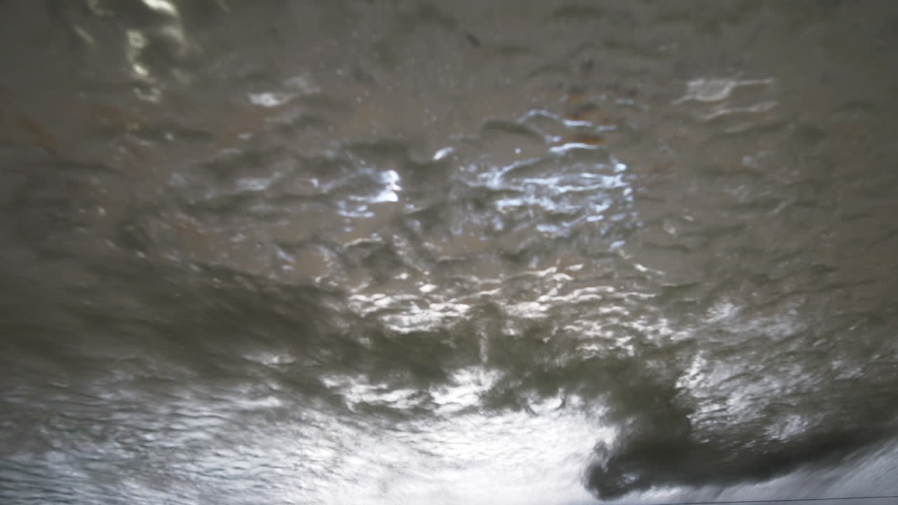 Automatic car wash sprays car windscreen with soap and water
