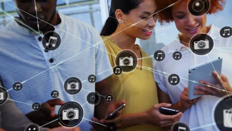 animation of network of connections over diverse business people using tablet