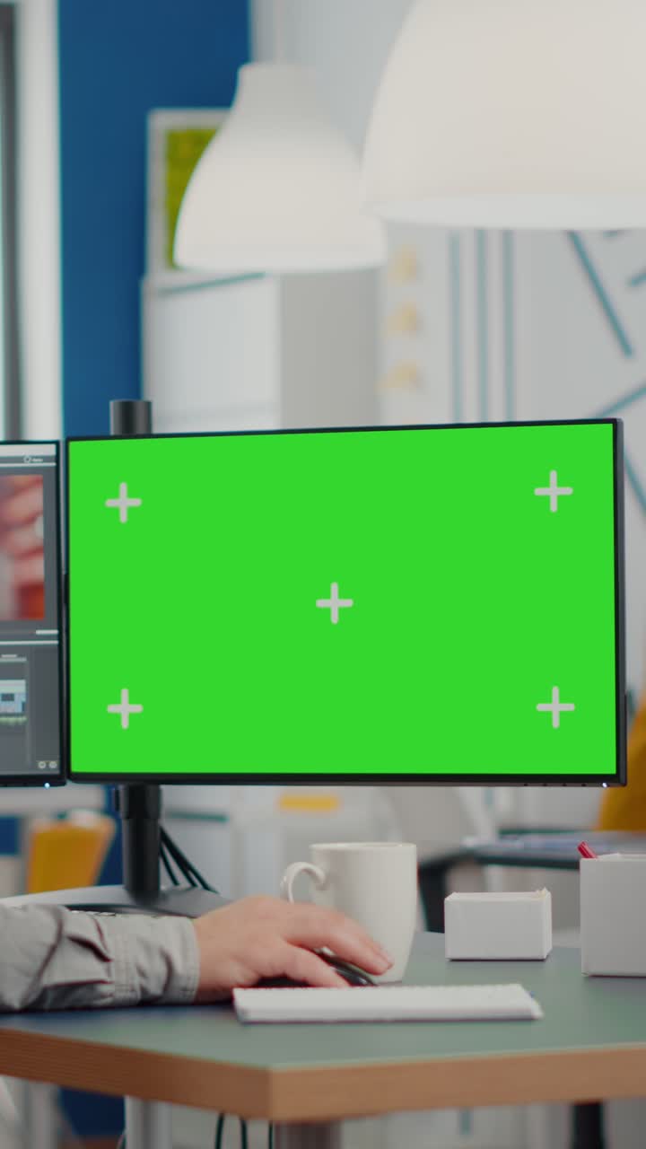 Vertical video Videographer using computer with chroma key display