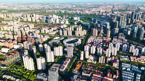 slow aerial establishing shot of yuanshen sports stadium in shanghai