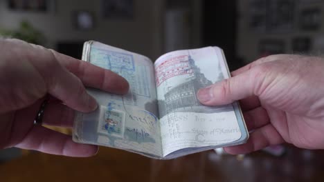 a passport full of stamps and visas after a lifetime of travel - close up