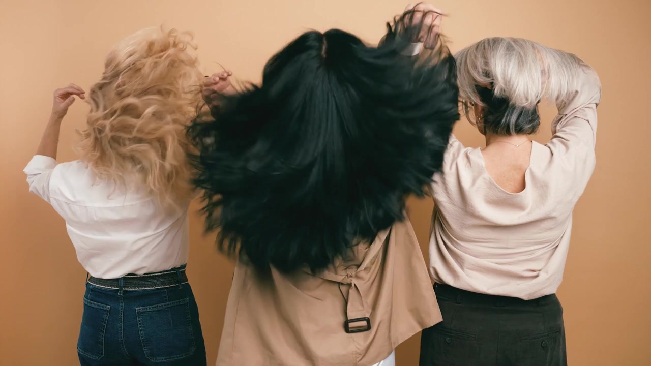 Three Women With Different Hair Types Posing Back to Camera