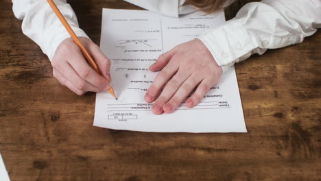 Close-up-view-of-student-hands