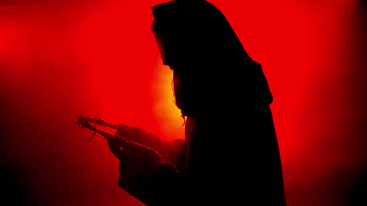 Jesus Christ holding crown of thorns for Christianity, Easter visual, bible scene or temptation, prayer, worship visual.