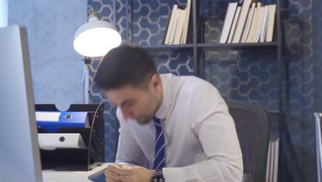 businessman working in office nervously looking at camera.