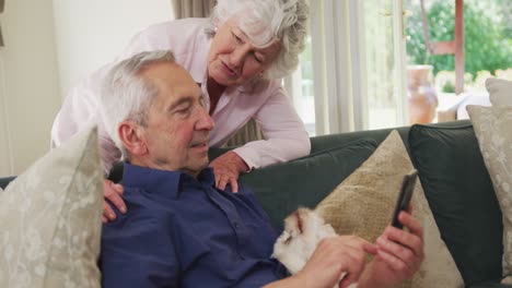 Senior-caucasian-couple-embracing-and-smiling