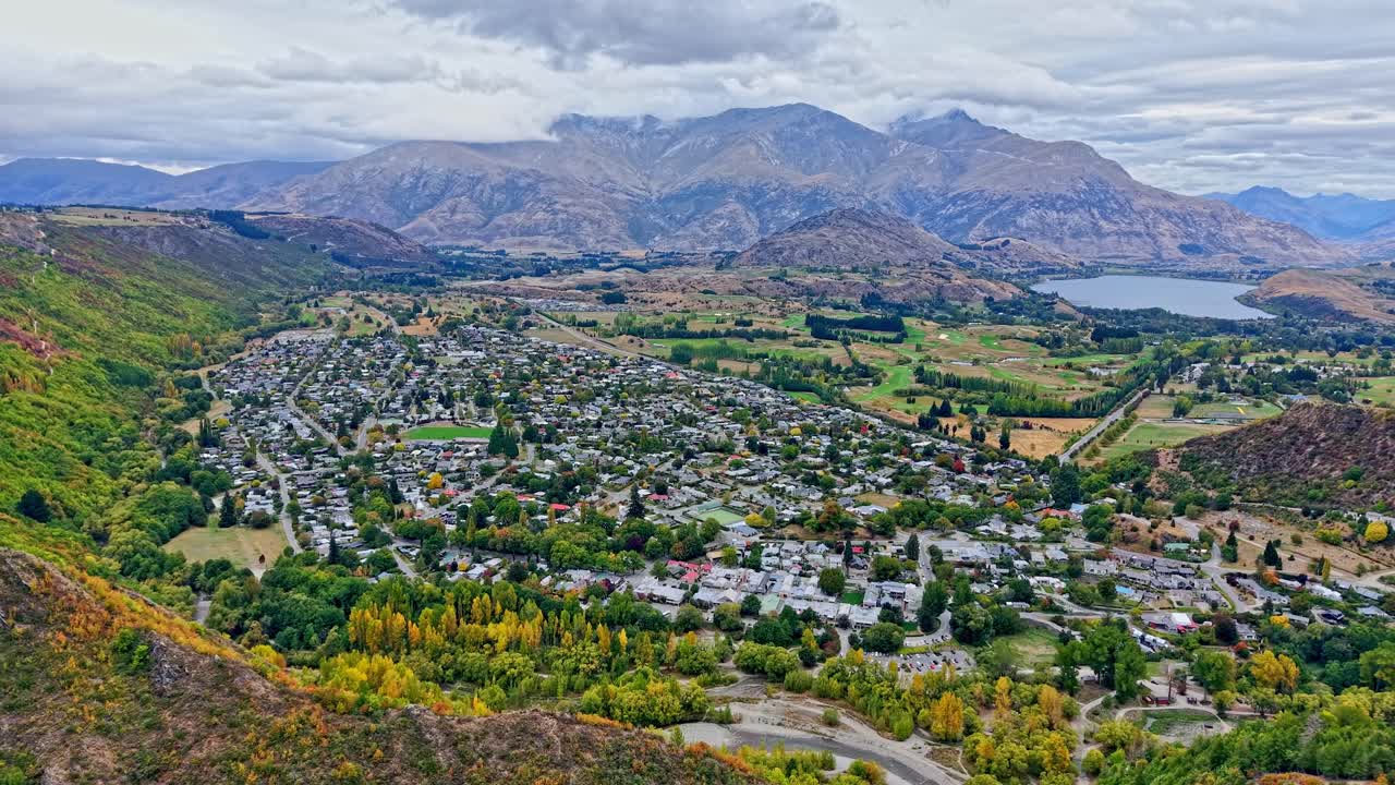 Unbelievable view of the Remarkables mountain range one of New zealand's most famous ridgelines visible from the iconic historical Arrowtown with lake Hayes in the background