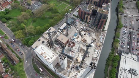 Overhead-drone-three-tower-cranes-on-building-site-Stratford-East-London-UK