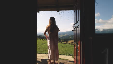 woman on a porch with mountain view
